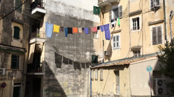 Clothes Drying on the Ropes With Their Shadows