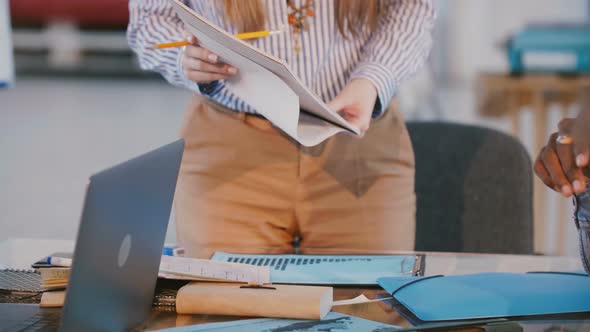 Close-up Shot of Successful Businesswoman Standing Behind Office Table on Business Team Meeting