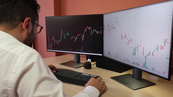 Stockbroker Analyzing Stock Market Data