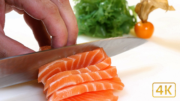 Sushi Chef Slices a Salmon Steak Nigiri Style