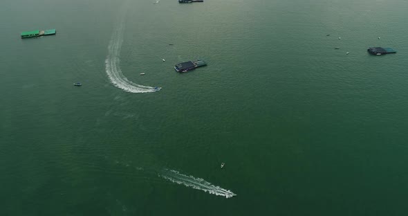 Aerial view of speed boats on the sea near beach city