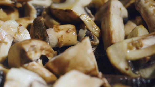 Juicy Moderately Roasted Mushrooms Cooked on a Frying Pan