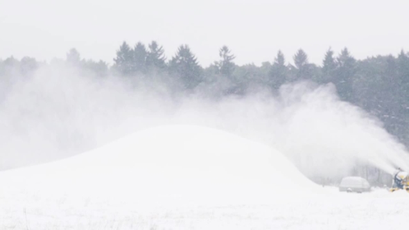 Snow Gun Making Hill Outdoors in Winter 15