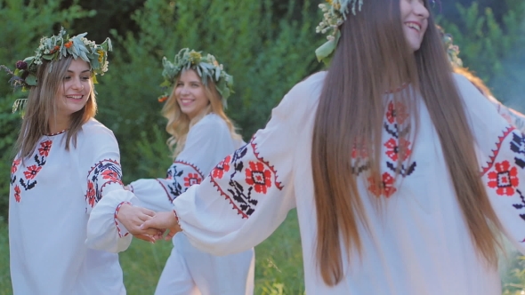 Group of Young People in National Slavic Costumes Dance