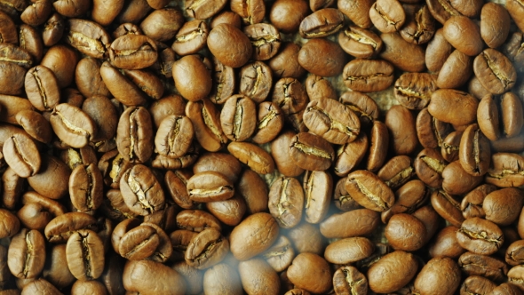 Hot Choicest Arabica Beans, Rotate. Above Them, a Wisp of Smoke