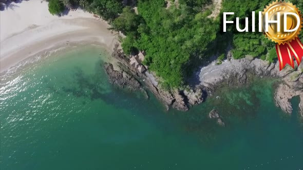 Aerial View of Lagoon With Sandy Beach, Umbrellas