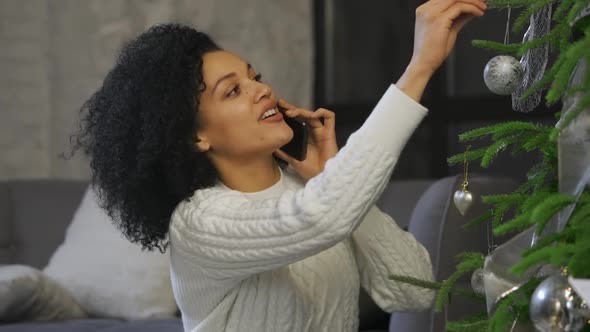 Portrait of a Happy African American Woman Talking on Her Smartphone