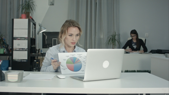 Office Woman Explaining Pie Chart To Colleagues Via Laptop
