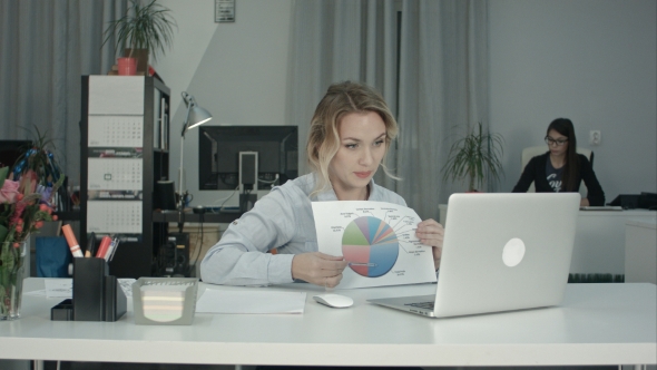 Young Female Employee Presenting Pie Chart Via Laptop Online Meeting