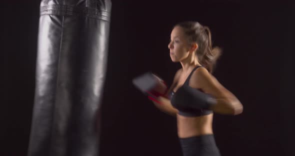 Athletic Woman Boxing Punching-Bag