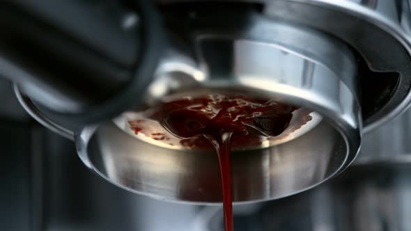 Super Slow Motion Macro Shot of Dripping Fresh Espresso Coffee From Lever Machine at 1000 Fps