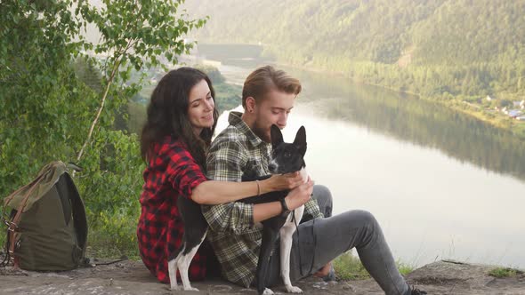 Young Couple and Their Charming Dog Outdoors, Free Time