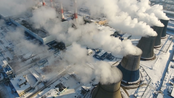 Smoke and Steam From Chimneys at a Thermal Power Station. Drone Shot.