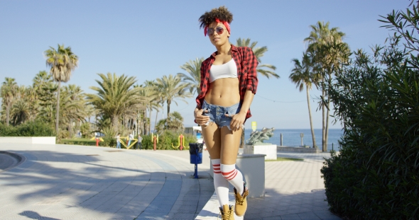 Adorable African American Girl Walking on Concrete