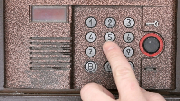 Person Opening Door Using a Numeric Code of Access