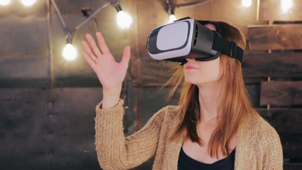 Young Woman Using Virtual Reality Glasses