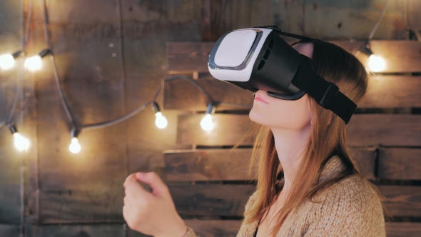 Young Woman Using Virtual Reality Glasses