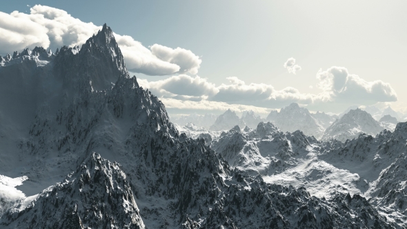 Mountains in Snow and Clouds at Blue Sky