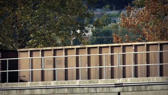 Train Containers Passing Through Suburban Area