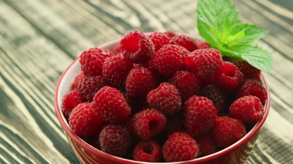 Bowl of Raspberry on Wooden Desk 