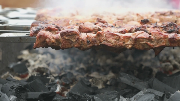 Meat Are Prepared on the Metal Skewers on a Grill