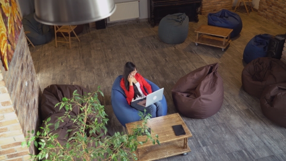 Top View Lady in Loft Room Working.