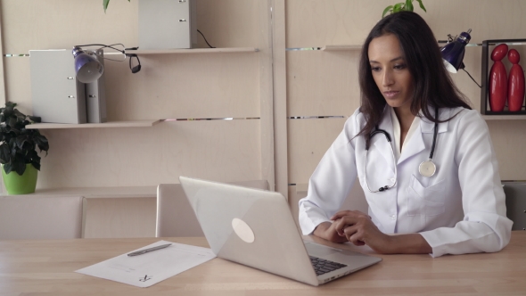 Mixed Race Physician Has Video Call Meeting