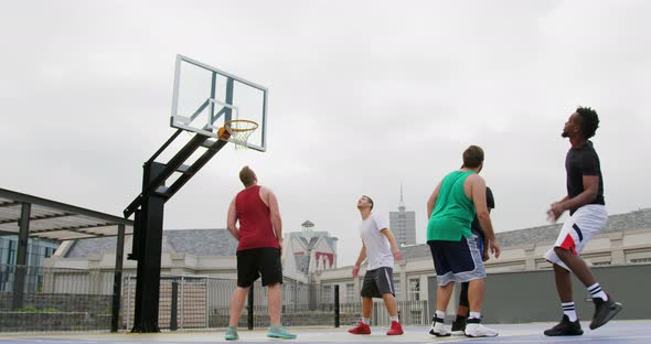 Basketball player throwing basketball in hoop 4k