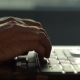 Male Hands Typing on a Laptop Keyboard - VideoHive Item for Sale