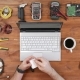 Male Engineer Programmer Copies Files From a Flash Card Action Camera on a Laptop. Wooden Table Top - VideoHive Item for Sale