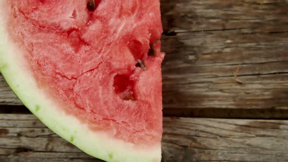Slice of watermelon on wooden table