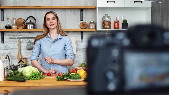 Adorable Woman Talking Recording Cooking Video at Kitchen