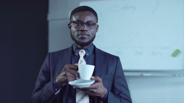 Cheerful African American Businessman Having a Hot Drink