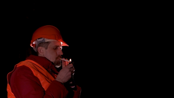 Worker Smoking a Cigarette When Resting