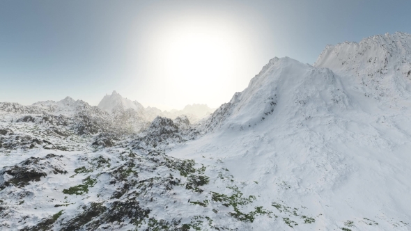 Mountains in Snow and Clouds at Blue Sky alt