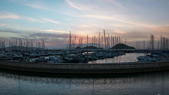 A Harbour View at Sunset. Yacht Marina with Night Illumination