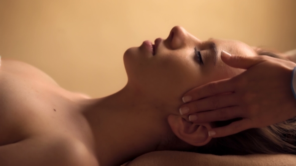 Beautiful Woman Having a Facial Massage