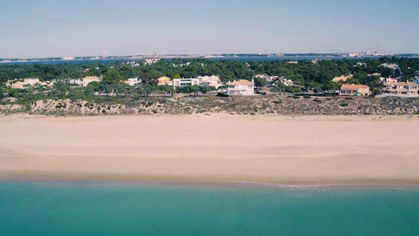 Flying Above Holiday Village on Shore Ocean