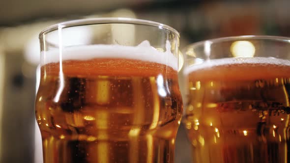 Foamy Beer in Glasses Closeup