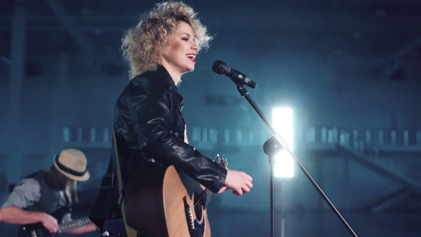 Woman in Leather Jacket Singing