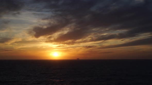 Ship cruising on sunset in the mediterranean sea. Realtime video