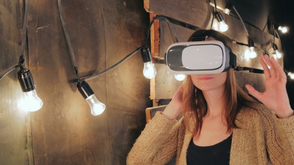 Young Woman Using Virtual Reality Glasses