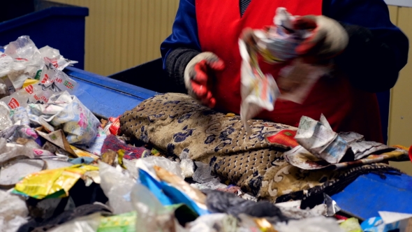 Sorting Process at a Garbage Recycling Plant. Enviroment Protection Concept.