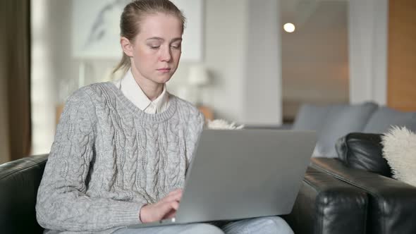 Professional Young Woman Working From Home on Laptop 