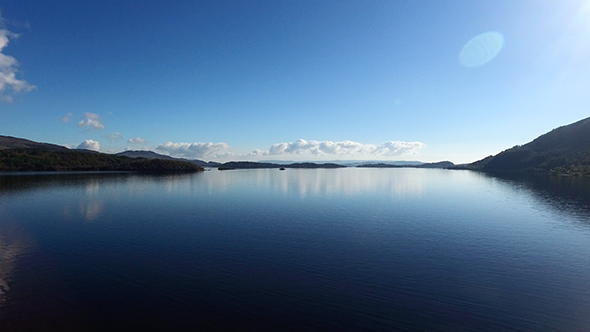 Drone Flying Over a Beautiful Blue Lake