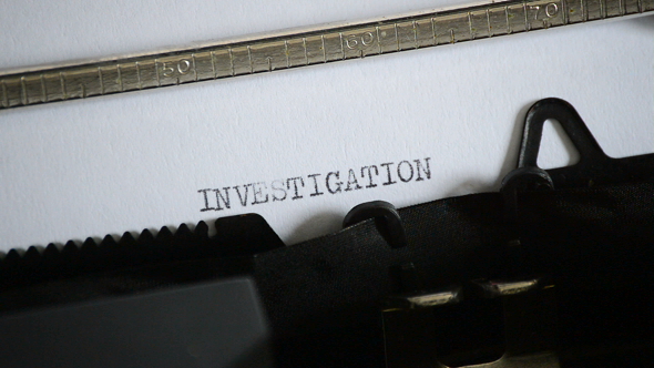 Typing the Word INVESTIGATION with an Old Manual Typewriter