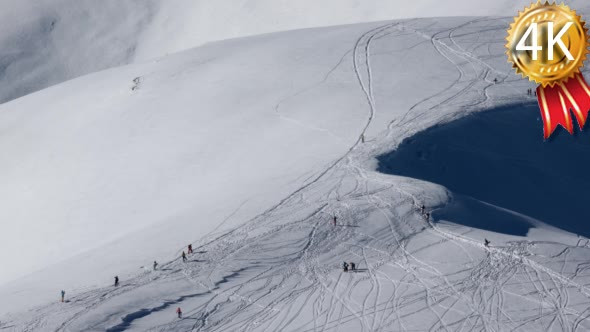 a Freestyle Skiers and Snowboarders Charges Down