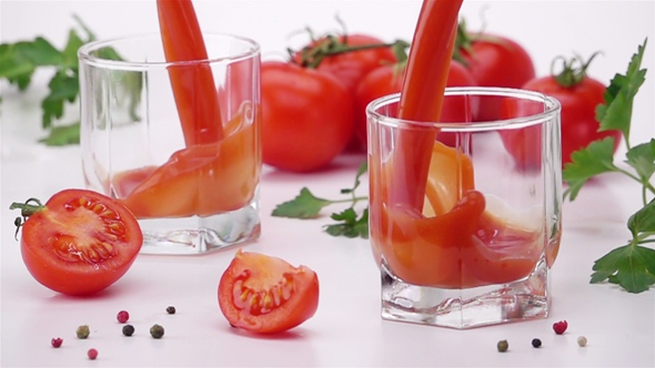 Pouring Tomato Juice Into Glass.