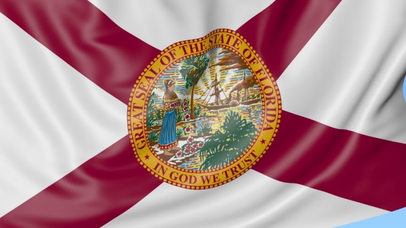 Waving Flag of Florida State Against Blue Sky