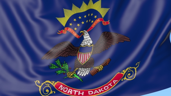 Waving Flag of North Dakota State Against Blue Sky alt